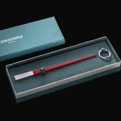 Christofle Set of two red Chinese chopsticks and chopsticks rests